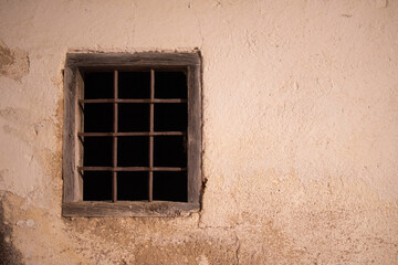 old window with iron bars
