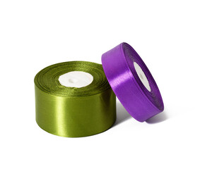 two rolls of silk green and purple ribbon, wrapping decor, white isolated background