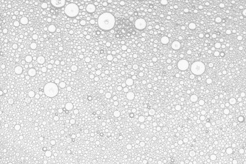 Аbstract image of oil and water white bubbles. White artistic image of oil drop on water for modern and creation design background