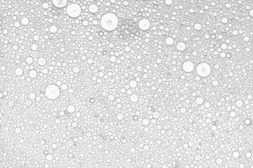 Аbstract image of oil and water white bubbles. White artistic image of oil drop on water for modern and creation design background