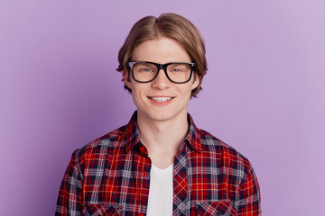 Portrait of positive nice attractive guy look camera toothy beaming smile on purple background