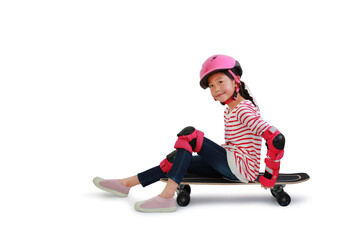 Asian little girl child skateboarder with wearing safety and protective equipment sitting on skateboard isolated on white background