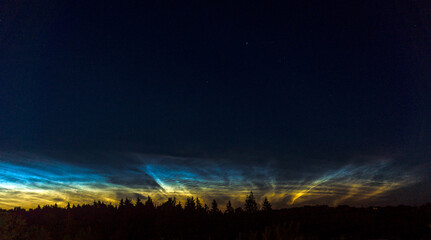 Silver clouds. Noctilucent clouds are highest clouds in the Earth's atmosphere visible in a deep twilight. 