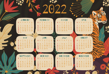2022 year calendar concept with  hand drawn illustrations of tiger and jungle leaves.