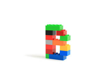 Obraz premium Alphabet letters B from colorful plastic brick block constructor isolated on white background. Image with Clipping path