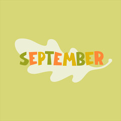 September - Autumn seasonal background. Hand lettering against backdrop of oak leaf