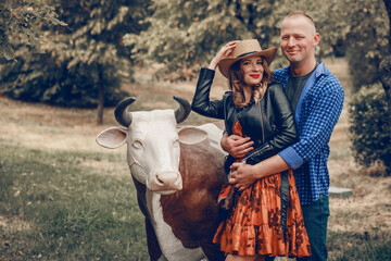 Young couple having fun in park. Happy romantic moments of a lovely couple fooling around in the...