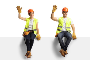 Male and female construction workers sitting on a panel and waving