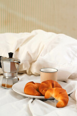 Italian breakfast with coffee, milk and croissant