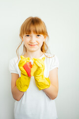 girl in yellow gloves with cleaning sponges