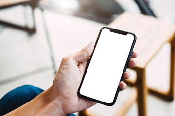 close up of a hand holding a mobile phone.