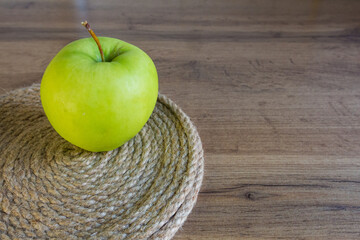 green apple wicker eco napkin on wooden table