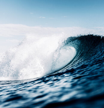 wave breaking on the sea surface, tube, aggressive, blue