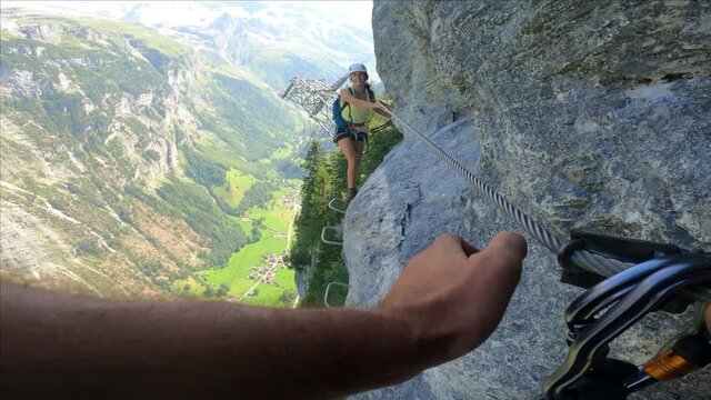 Via Ferrata from Murren to Gimmelwald. Risky rock climbing on Swiss Alps.