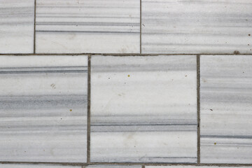 Natural marble texture - pavement paved with marble slabs. Marble background.