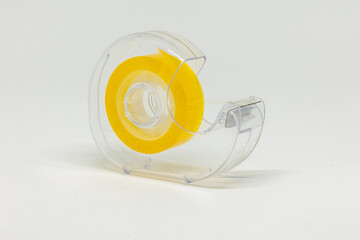 Closeup of a tape cutter on white background.