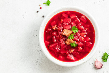 Traditional borscht on light background. Top view, copy space.
