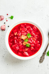 Classic borscht on light background. Top view, copy space.