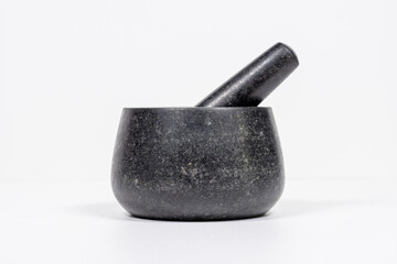 Granite tableware for grinding cocoa beans and spices. Close-up. Soft focus