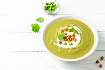 Split pea soup roasted chickpeas on wooden background. Copy space.