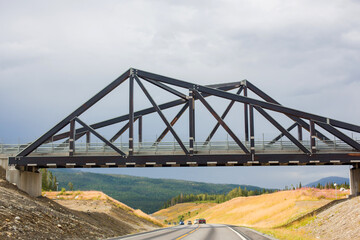 Fototapeta na wymiar Beautiful landscape with bridge over the road in Norway