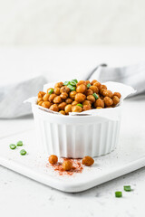 Healthy spicy snack, baked chickpea in a bowl. Space for text.