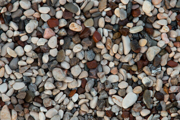 Galyaka on the beach, small colored pebbles, background, copy space.