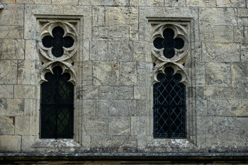 Medieval window in stone wall