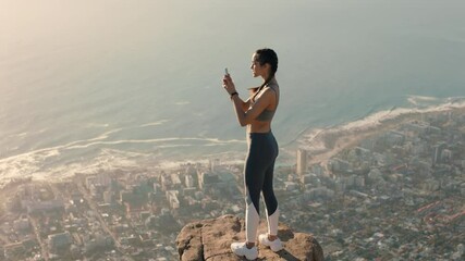young woman taking photos on mountain top using smartphone sharing hiking adventure girl photographing scenic view with mobile phone camera standing on edge of cliff at sunset - Powered by Adobe