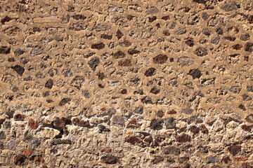 Old medieval wall made from yellow stone