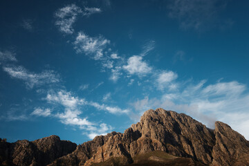 Jagged mountain peaks and big sky with clouds