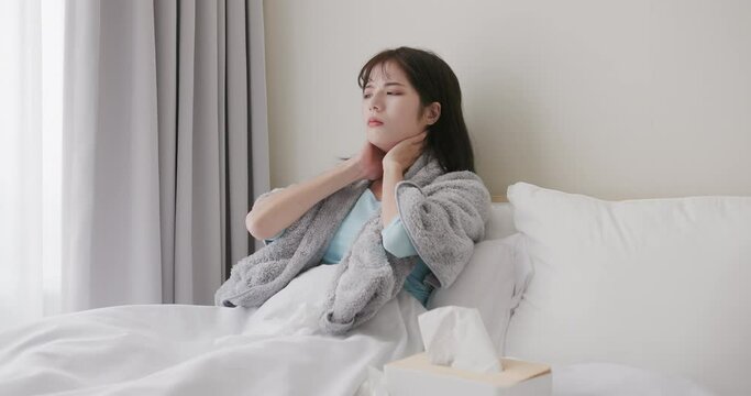 woman has fever on bed