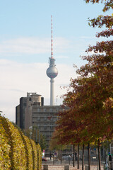 Naklejka premium A Berlin street scene in the autumn with the iconic TV tower in the background