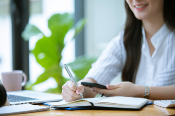 Beautiful Asian woman working freelance working happily Work from home and come up with new...
