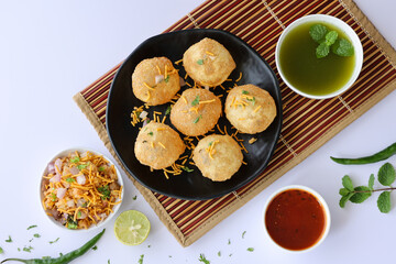 Girl women taking spicy Pani puri golgappe with hand, Chat item, India. North Indian street food  Indian panipuri snack eaten tangy tamarind water, potato stuffing Delhi, Mumbai, Holi Diwali Dussehra