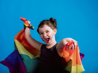 Cheerful girl holding multicolored flag