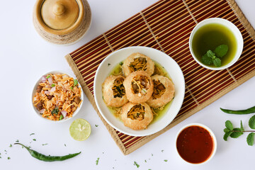 Girl women taking spicy Pani puri golgappe with hand, Chat item, India. North Indian street food  Indian panipuri snack eaten tangy tamarind water, potato stuffing Delhi, Mumbai, Holi Diwali Dussehra