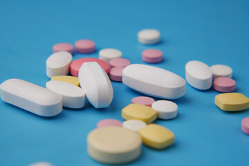 Close up of many colorful pills and capsules 