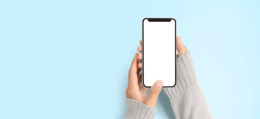 Hand holding smartphone and touching screen