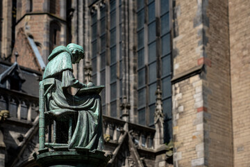 Obraz premium Statue writing monk in the Dom Garden of Utrecht, Utrecht Province, The Netherlands