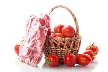 frozen tomatoes in a vacuum bag isolated on white