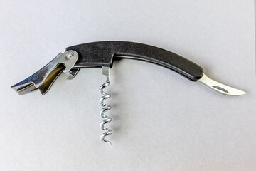Multifunctional pocket opener on a gray background
