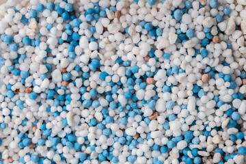 Background texture image of chemical fertilizer granules.