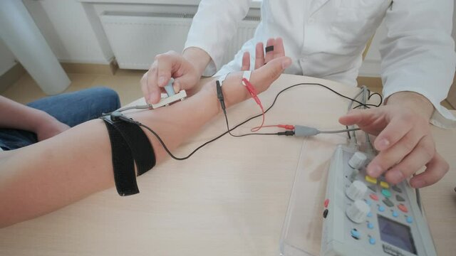 Patient nerves testing using electromyography at medical center