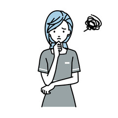 立って手をあごにあてて困っているエステ店員の女性