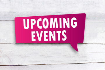  Upcoming Events text message bubble, concept wooden background 