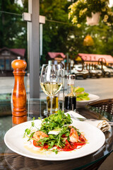 salad with shrimp and white wine in the restaurant