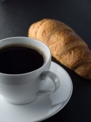 Cup of coffe and croissants