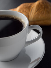Cup of coffe and croissants