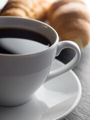 Cup of coffe and croissants